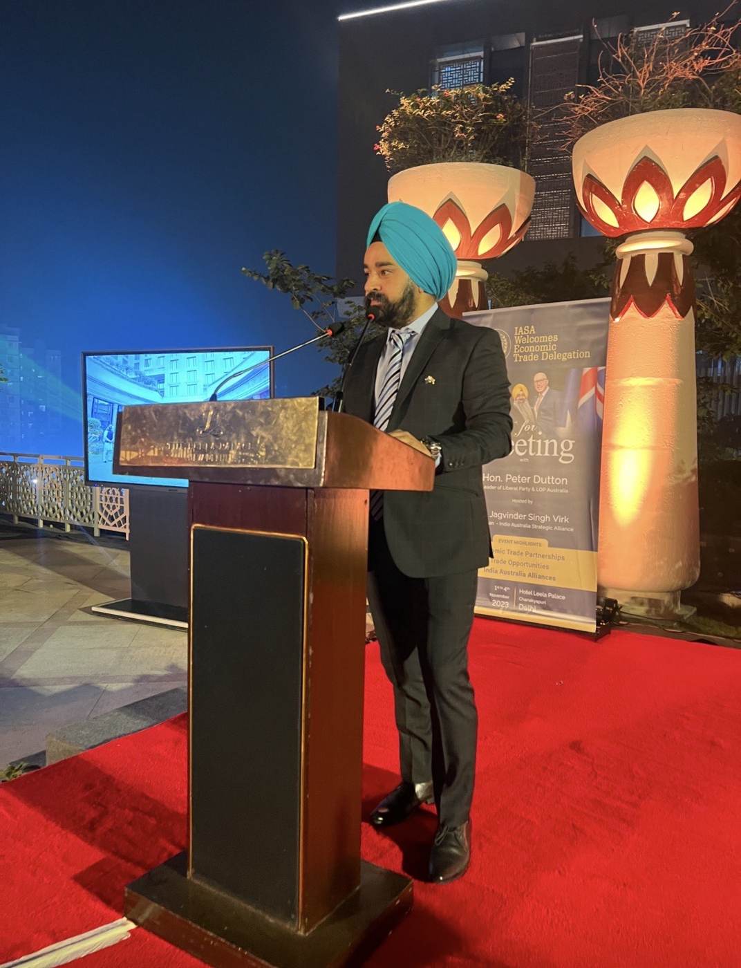 Raj Pahwa speaking at a podium during an India–Australia trade delegation event